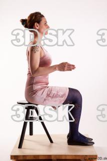 Sitting reference of whole body pink dress purple tights black…